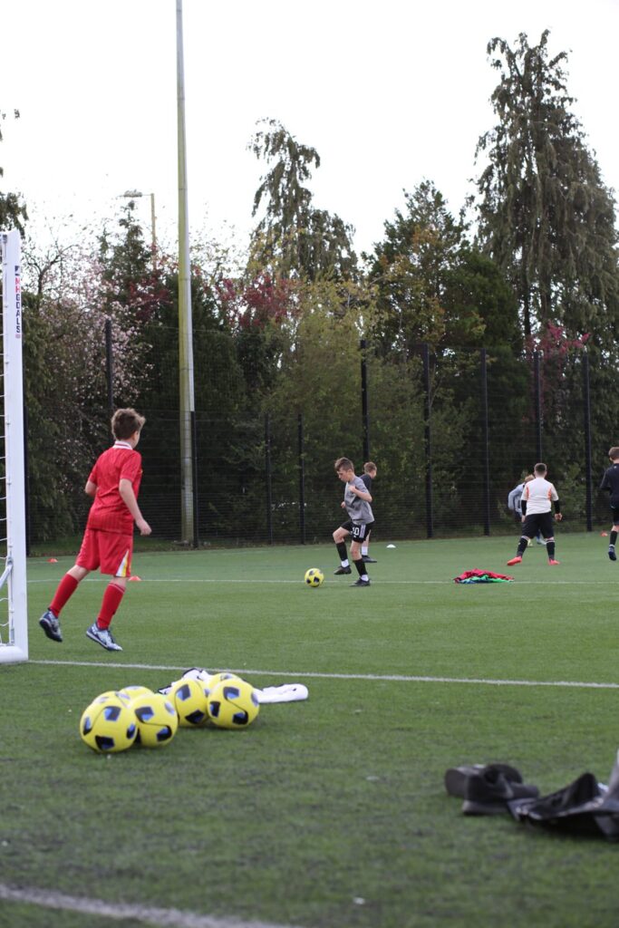 A young player in the goal area