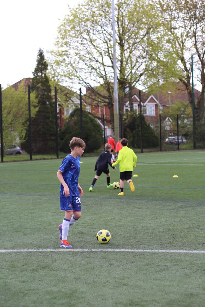 A player dribbling in training