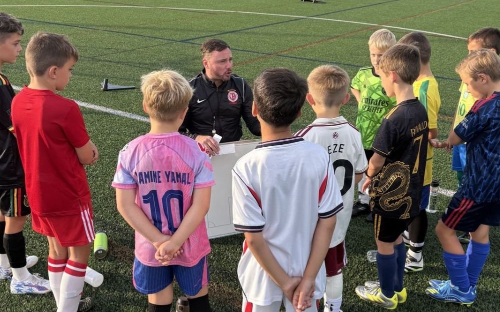 Coaches running a term-time training session